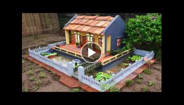 Make your garden more beautiful with a mini house and aquarium